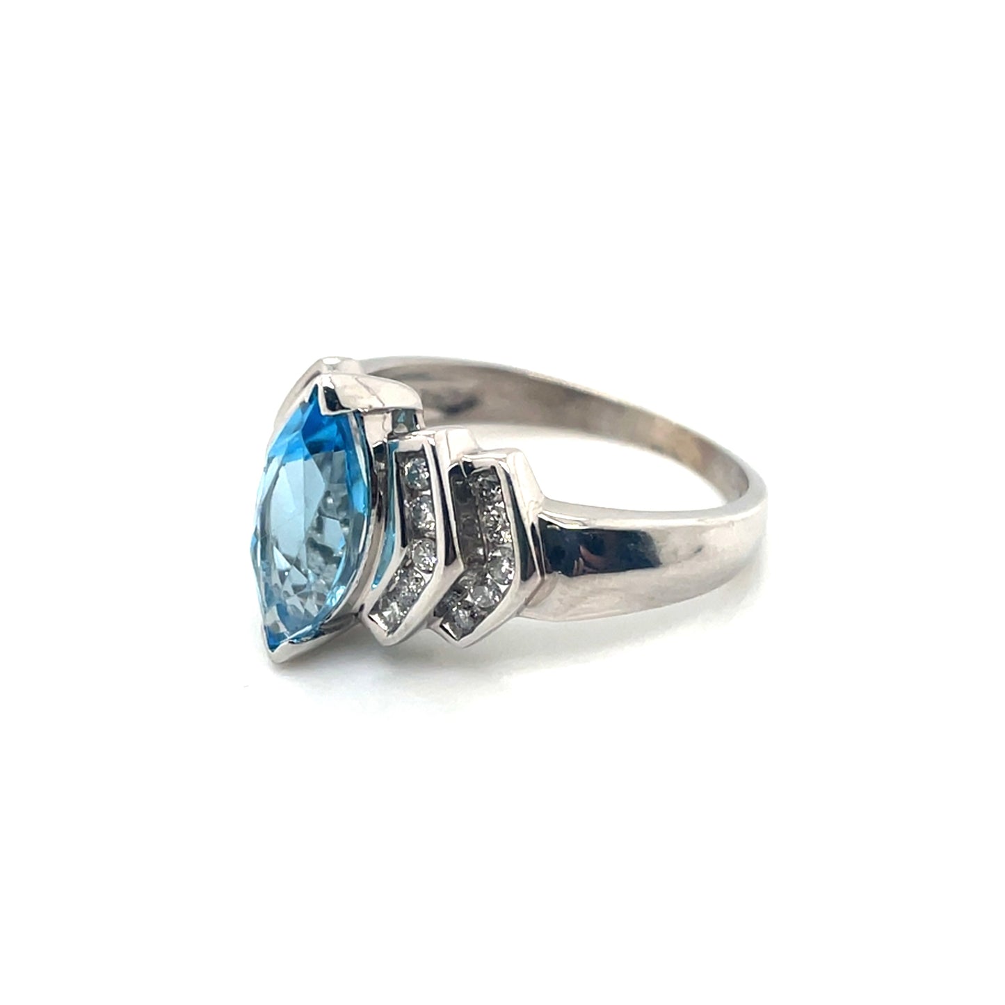 10k White Gold Topaz and 0.30 CT TW Diamonds Ring