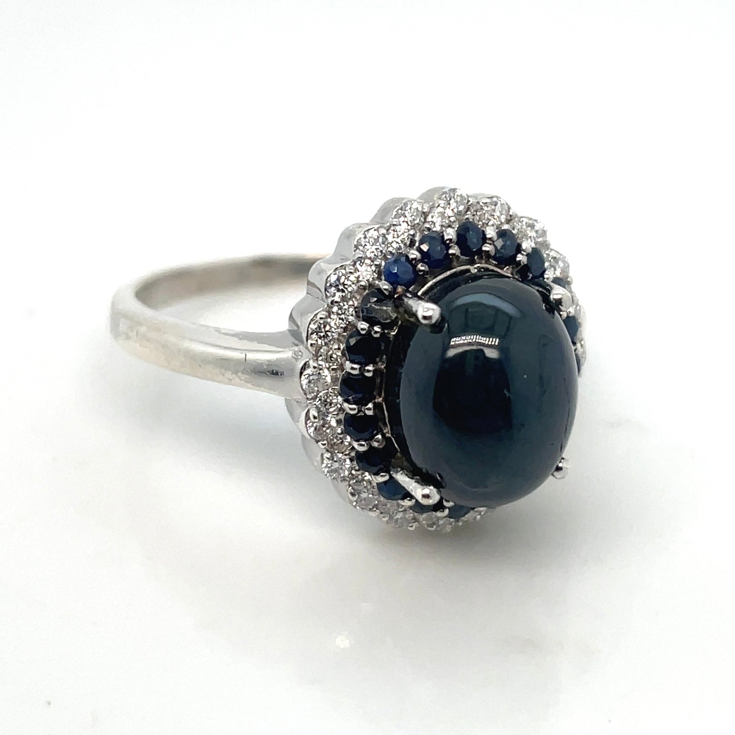 Round White Cubic Zirconia, Round Blue Sapphire, Central Cabochon Cut Sapphire Stone in Silver Ring